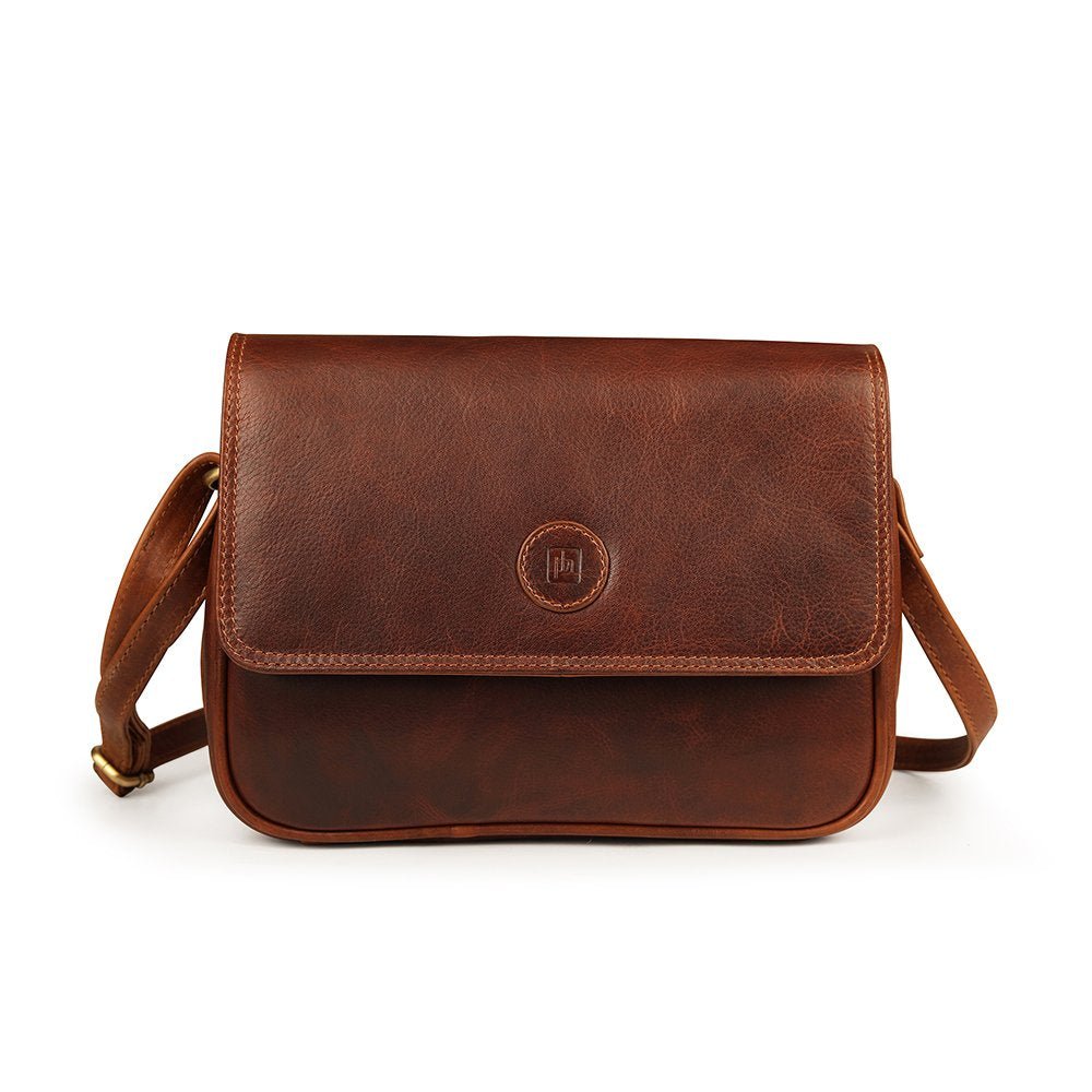 Front view of Orion brown leather handbag by Primehide with back zip pocket.